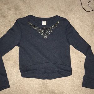 Long sleeve, navy blue gem neckline shirt.